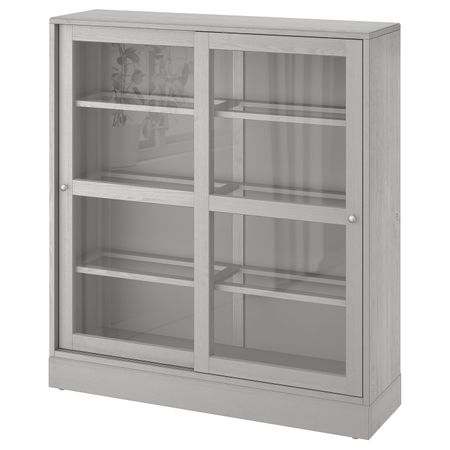 Шкаф-витрина с цоколем, серый/прозрачное стекло 121x37x134 см IKEA HAVSTA ХАВСТА 992.751.18